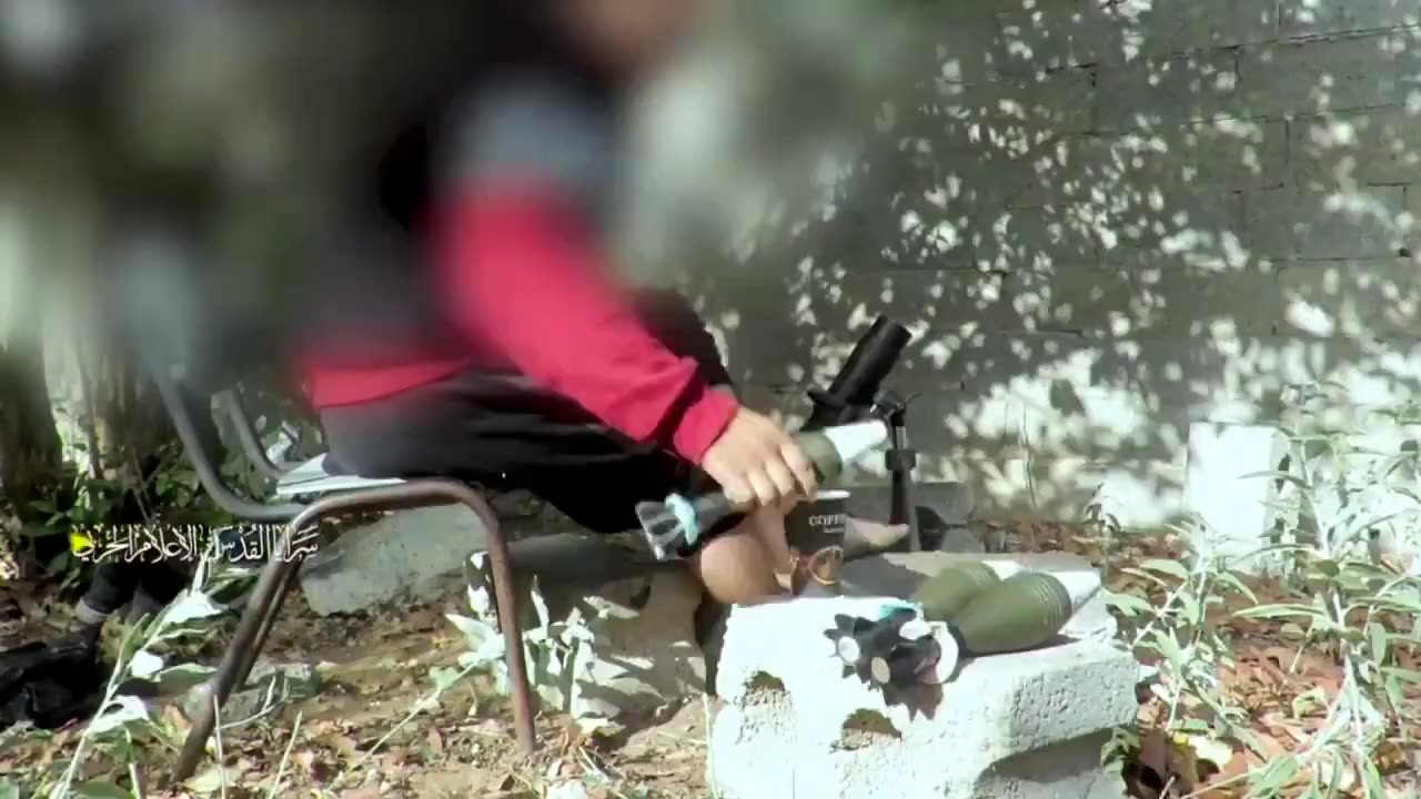 An "innocent civilian" in Gaza sits in civilian clothes and firing mortars at Israel