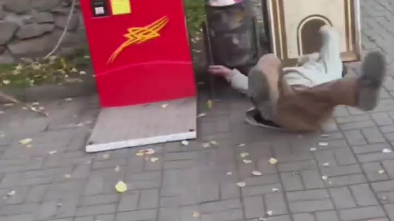 old man doesn't have a good time with punching bag game.