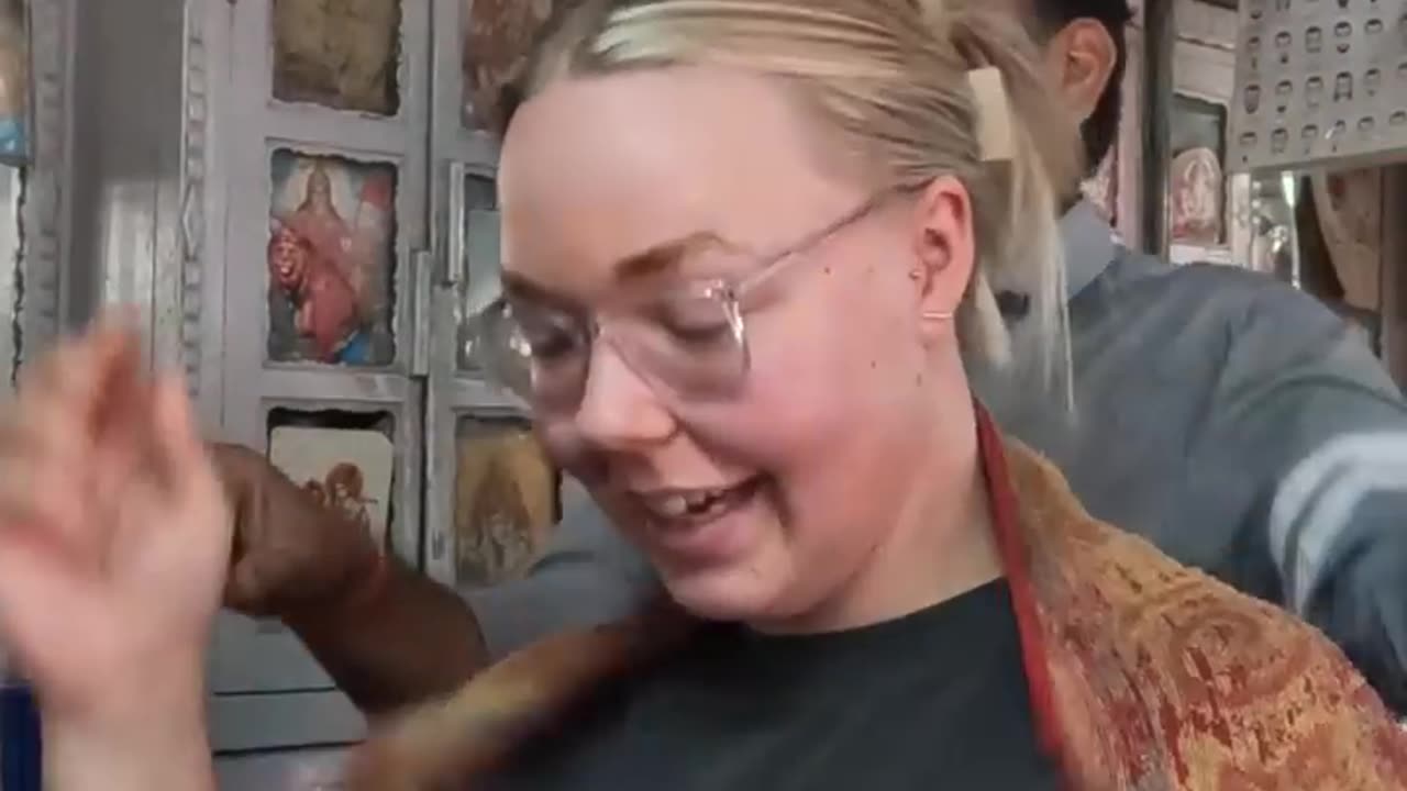 A woman from Australia receives an insane indian head massage as part of a cultural exchange.