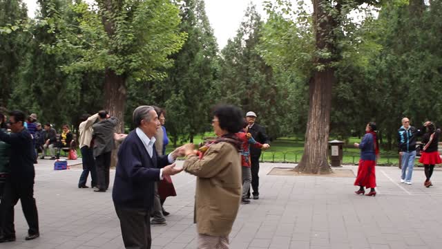 Happy couples dancing in the park, Beijing, China