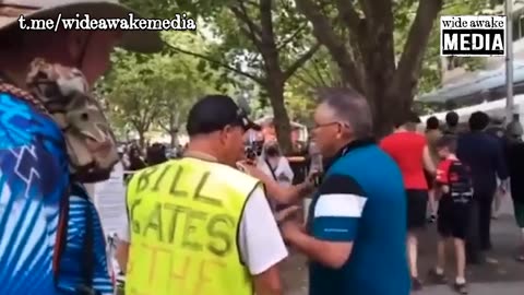 Canberra, Australia: Heavily boostered man gets triggered by a memorial for vaccine deaths.