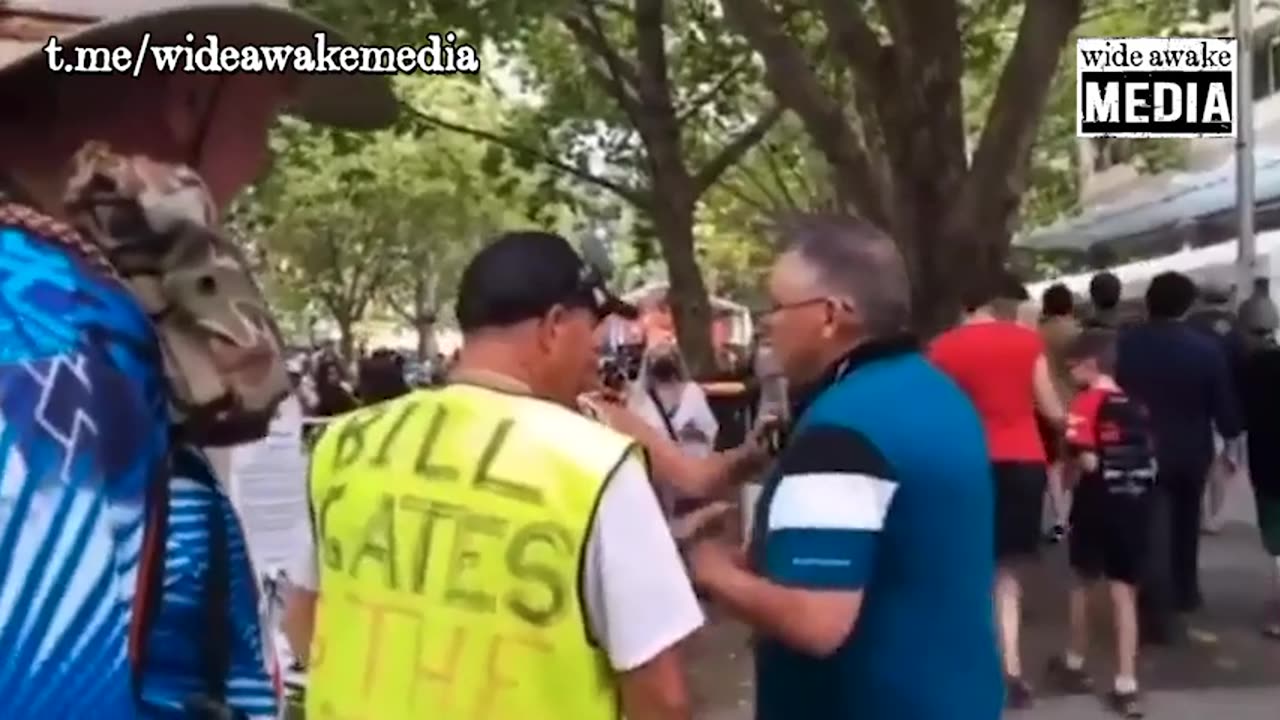 Canberra, Australia: Heavily boostered man gets triggered by a memorial for vaccine deaths.