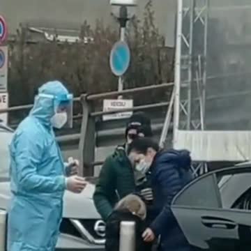 Italy - Parents forcing their crying child to get swabbed by a covid tester