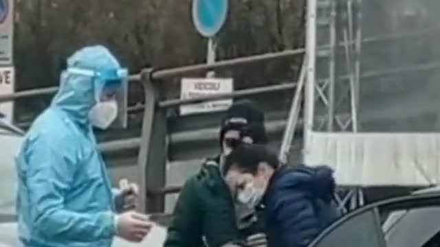 Italy - Parents forcing their crying child to get swabbed by a covid tester