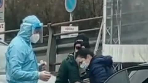 Italy - Parents forcing their crying child to get swabbed by a covid tester