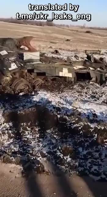 Ukrainian soldier show scattered remains of a Ukrainian armored vehicle