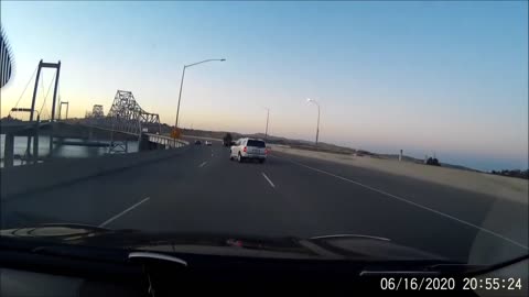 White SUV loses control and flies off of the Carquinez Bridge.