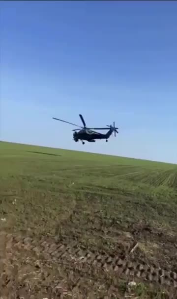 Russian soldier records himself between a KA-52 and a MI-28 flying extremely low