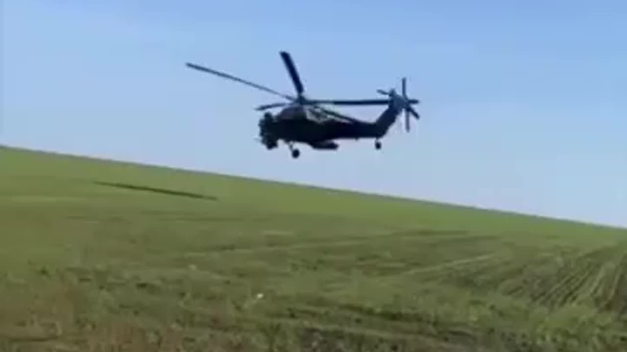 Russian soldier records himself between a KA-52 and a MI-28 flying extremely low