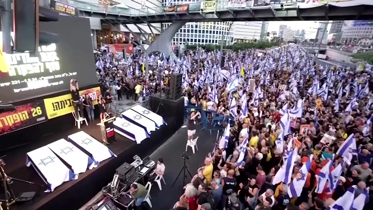 Tel Aviv protesters set off flares after hostage deaths