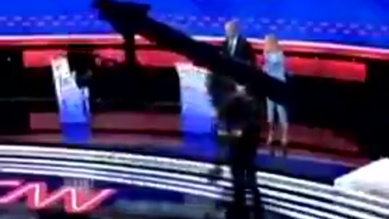 Zoomed in video of Jill Biden leading Joe off the debate stage