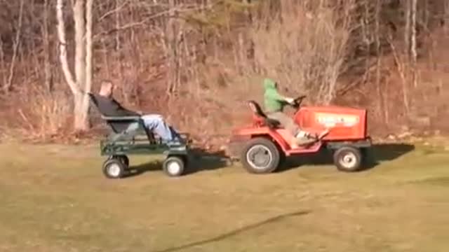 MM #1 - 2009 Daniel giving tractor rides with Grammy's new Kubota G6200H