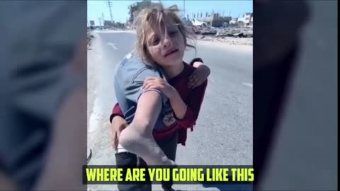 Gazan girl carrying her injured sister on her shoulders and walking for more than two kilometers #Gaza