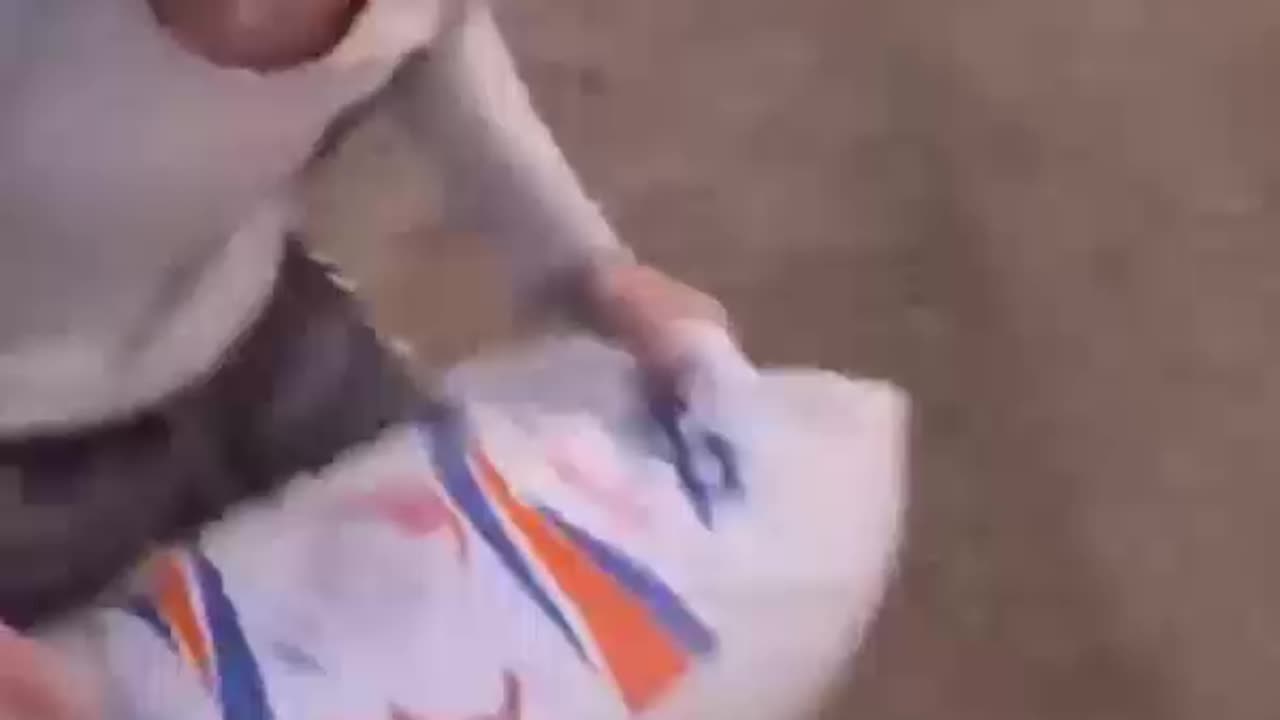 Palestinian man celebrates obtaining 25 kilograms of flour