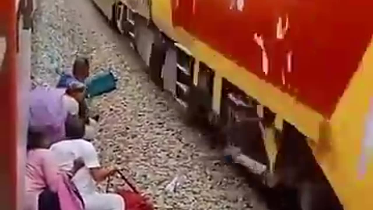 Railway Track Ruckus: Passengers Cross Seconds Before Train s Arrival | #Shorts | #ViralVideo