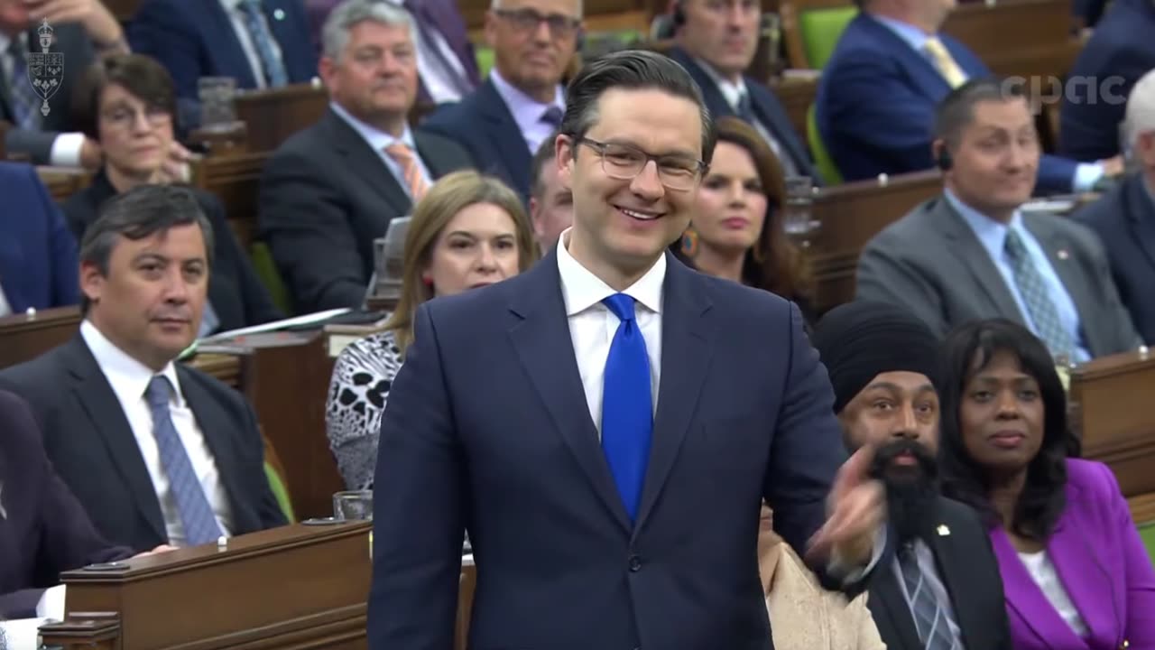 A climate protestor interrupts proceedings in the House of Commons during Question Period