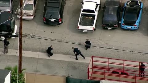 Suspect in LA police pursuit runs, hides under car