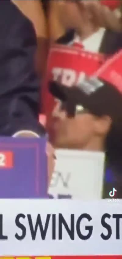 Suspicious: This video of a woman positioned behind Trump