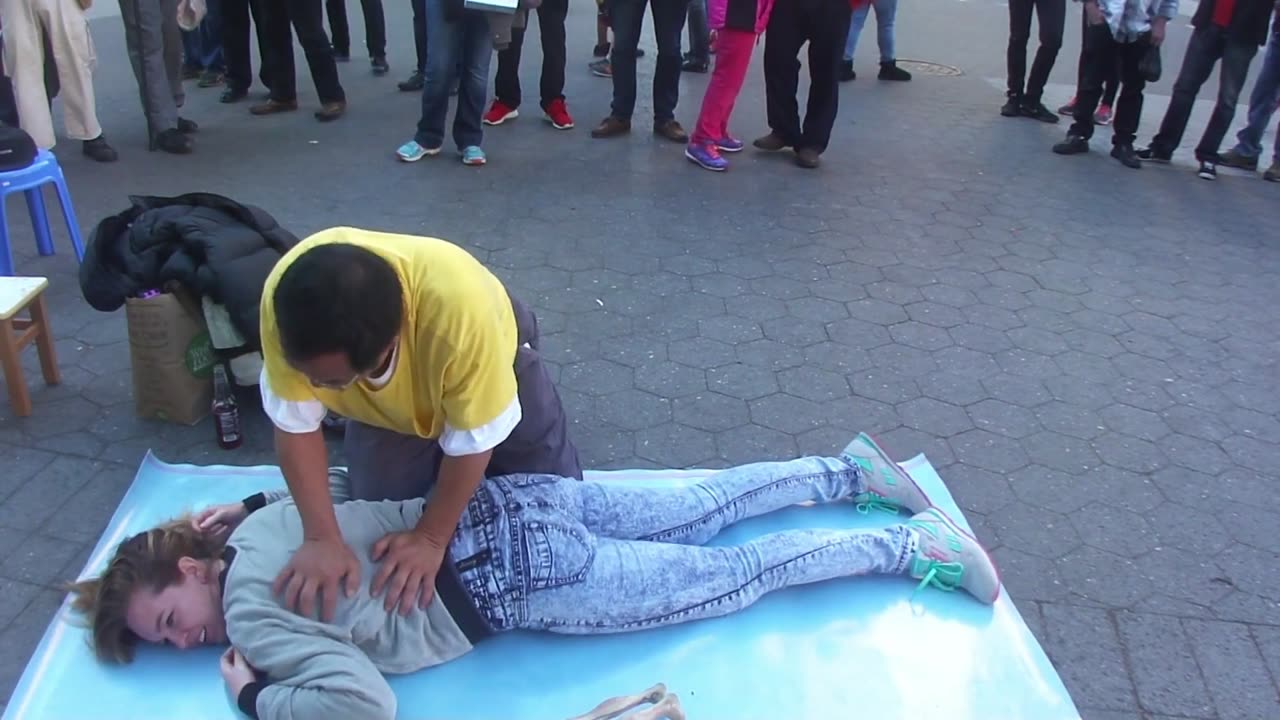 Luodong Massages Cute Blonde Girl In Front Of Crowd