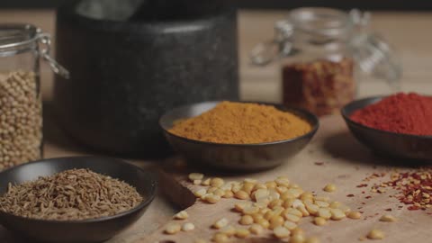 Tracking In Shot from Spices to Mortar and Pestle on Table