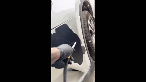 Automobile maintenance by repainting bumper