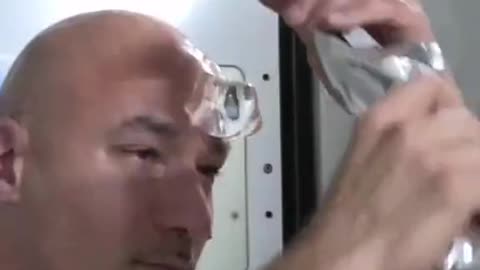 NASA astronaut washing his head In space