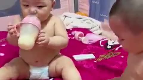 Two baby kids are fitting for drink milk 😜