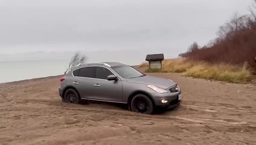 Infiniti EX35 cruising through sand