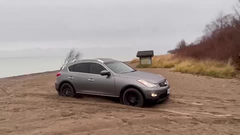 Infiniti EX35 cruising through sand