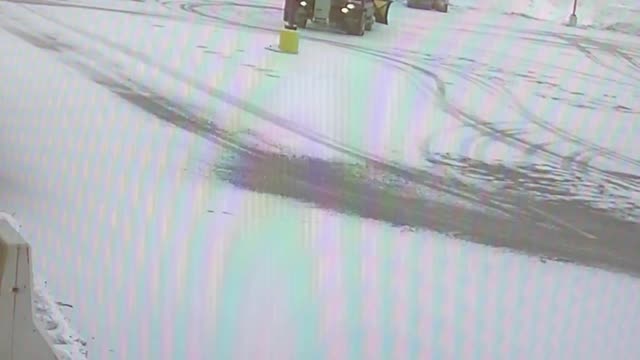 Snowplow Backs Into Light Pole