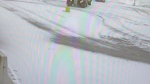 Snowplow Backs Into Light Pole