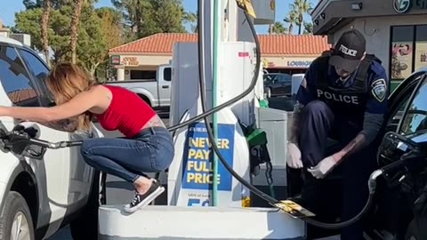 Woman steals gas from Policeman!