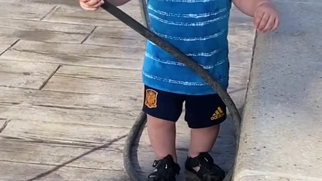 The joy of this child playing with his dog