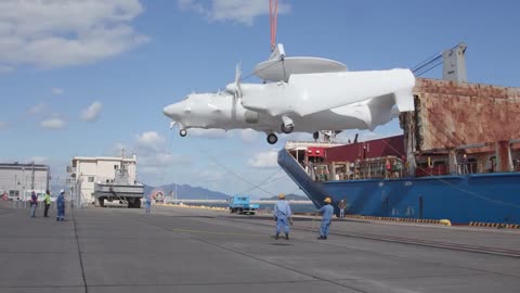 Northrop Grumman E-2D Hawkeye AWACS Gets Offloaded from a huge Container Ship