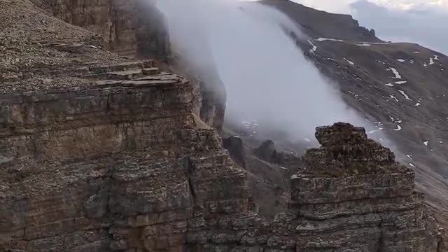 Fog on the Mountain Cliff