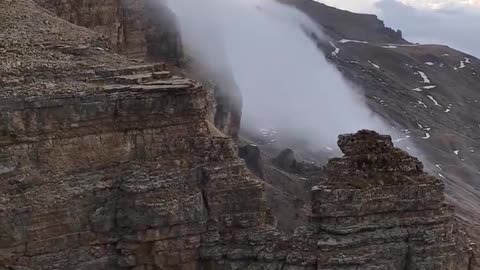 Fog on the Mountain Cliff