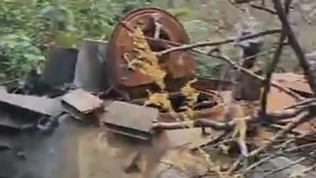 A destroyed russian tank up-close with its turret blown off