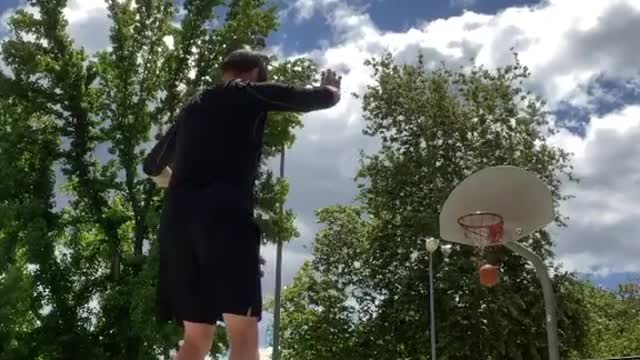 Guy Scores Basket While Balancing on Two Other Basketballs and Makes Three Shots in Row