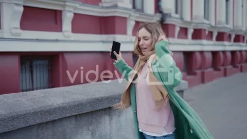 Joyful Excited Smiling Woman Walking And Spinning On The Street