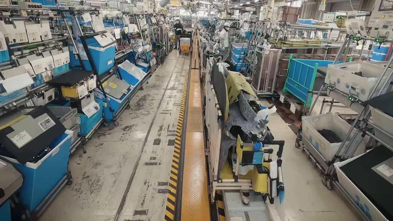 Nissan's car factory assistants, automated guided vehicles, are evolving