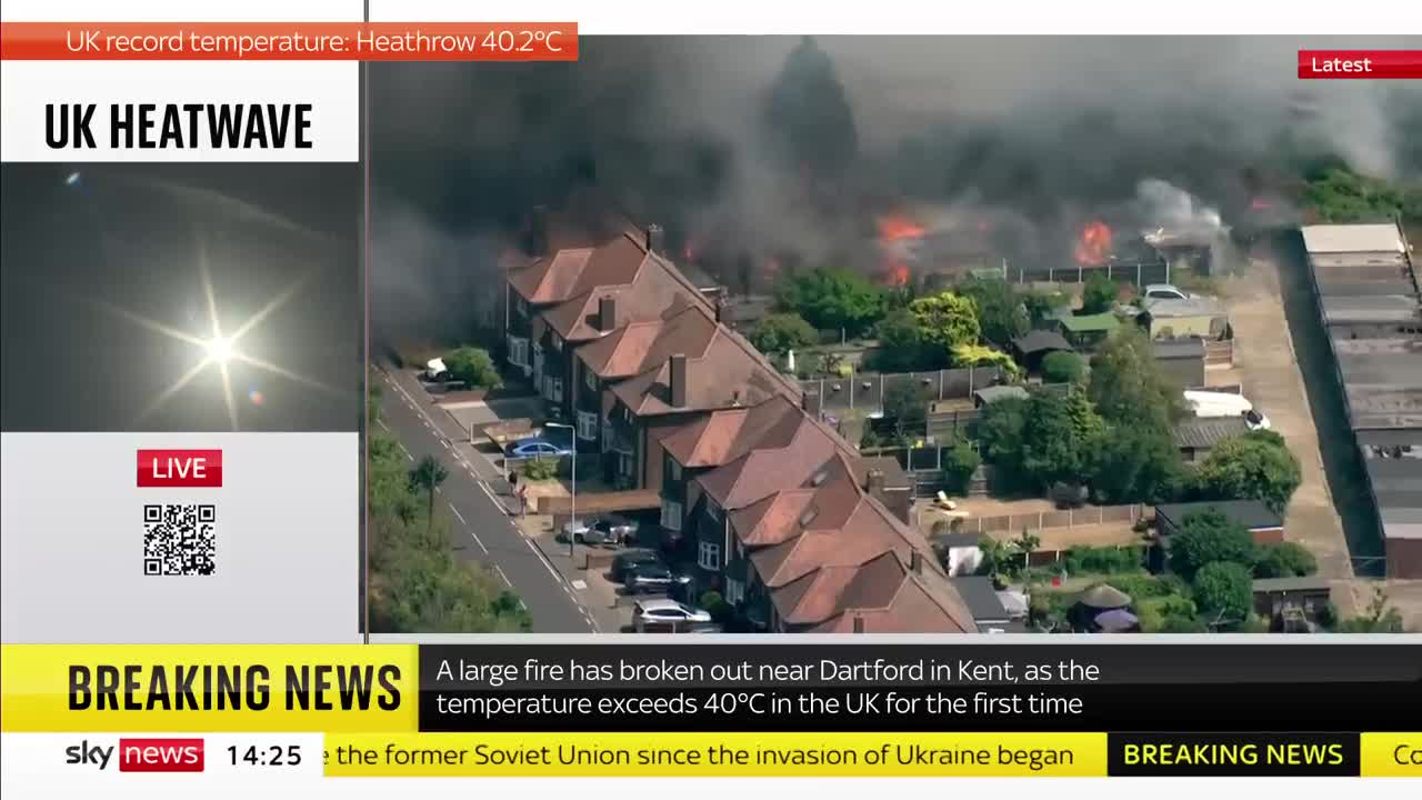 Houses ablaze as grass fire engulfs village outside London