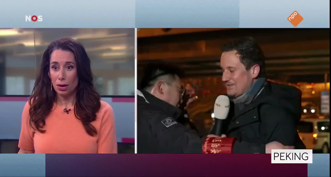 Dutch reporter, who is in Beijing to cover the games, pulled away by CCP agents while on air