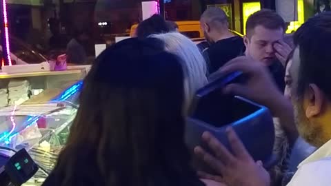 Girl gets her head stuck in a garbage bin's lid