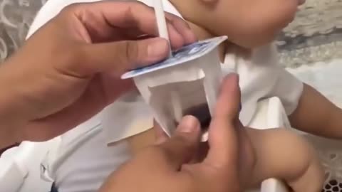 "Dad's Sticky Prank: Baby's Priceless Expression"very Funny😂