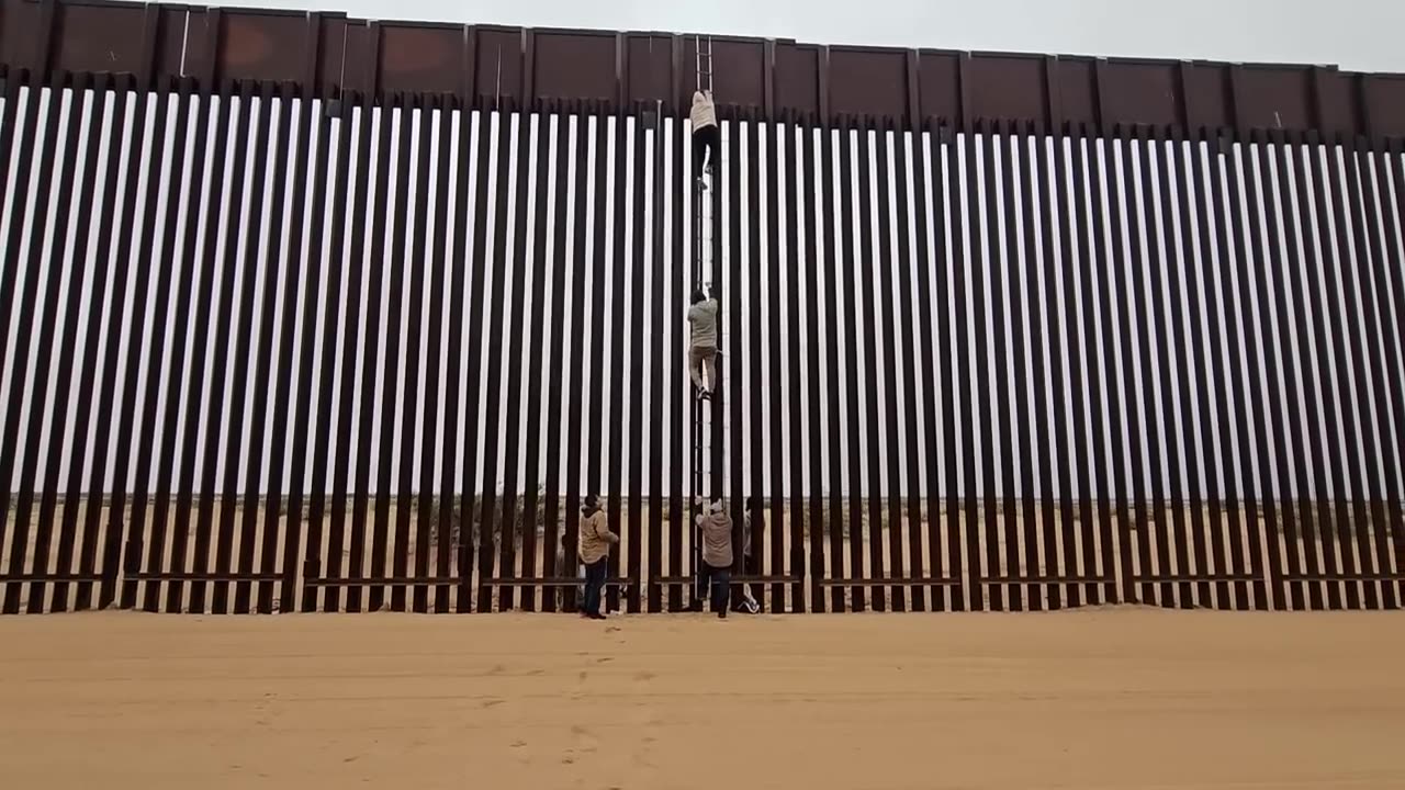 SHOCKING FOOTAGE! Watch Migrants Climb Border Wall. San Luis Arizona.