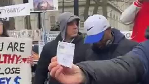 Vaccinated People Rip Up Vaccine Passports in Protest