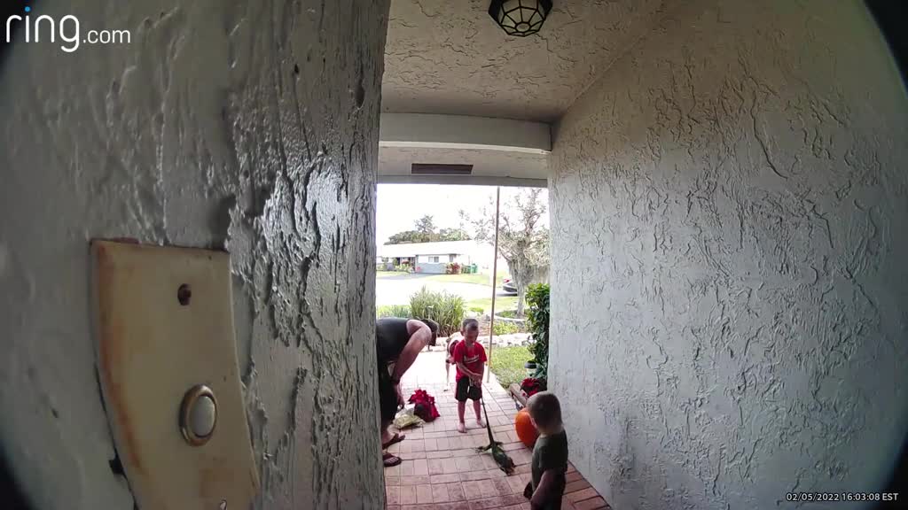 Dad Helps Kids Move Iguana