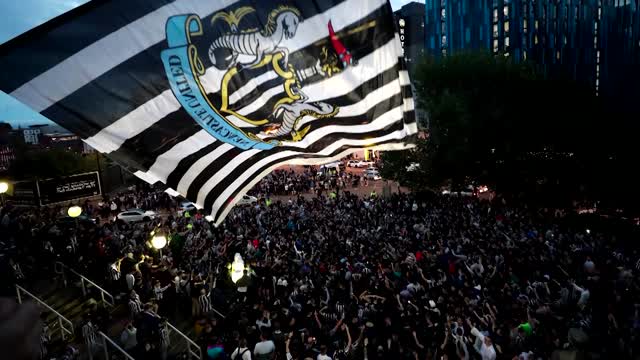 Newcastle fans celebrate club's Saudi takeover