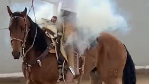 The man on the horse had smoke in his hands