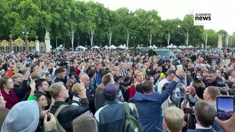 Crowd Gathers Outside Buckingham Palace To Sing “God Save The Queen”